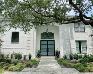 White painted brick home exterior in Sherwin Williams 7005 Pure White by Paper Moon Painting, Alamo Heights TX