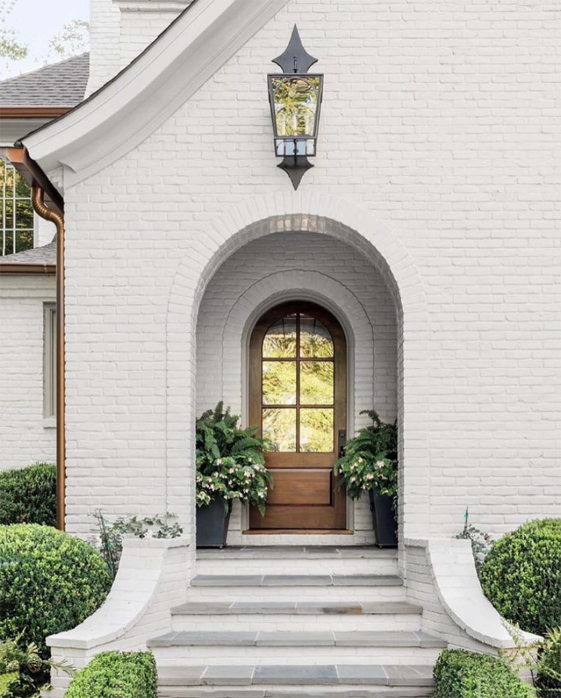 white-painted-brick-home-exterior-in-benjamin-moore-balboa-mist-by-ladisicfinehomes