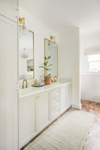 vanity-in-primary-bath-in-historic-home-update-with-black-tub-and-walls-painted-in-farrow-and-ball-all-white